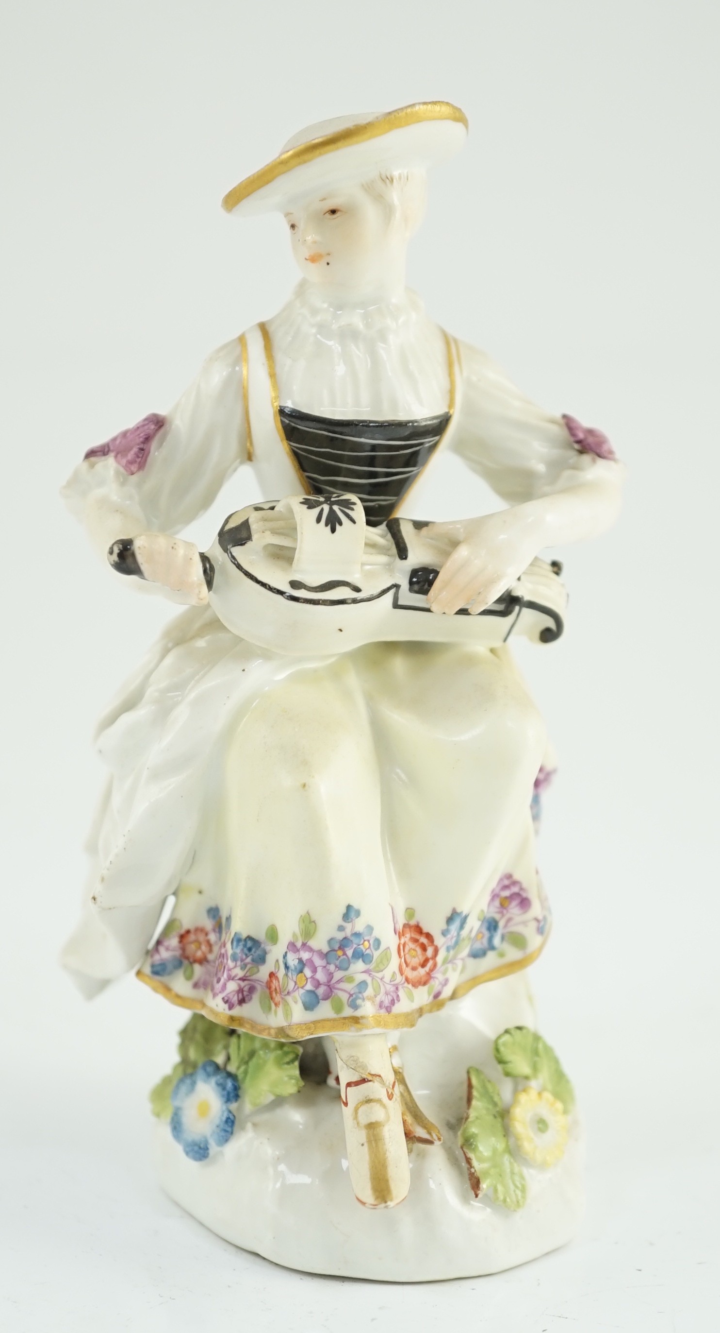 A Meissen porcelain figure of a woman playing the hurdy gurdy, mid 18th century, possibly modelled by J. J. Kandler, 13cm high, restored right foot, Provenance - purchased from Winifred Williams, Eastbourne/London before